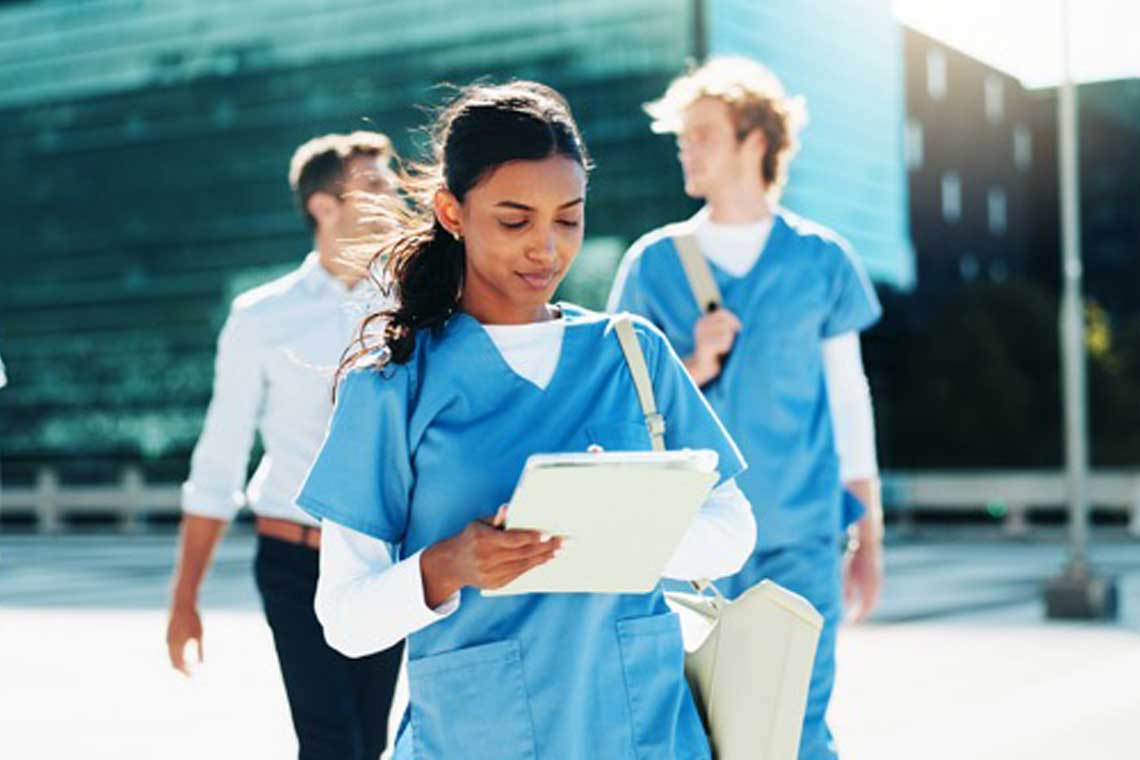 Travel nurse walking outside